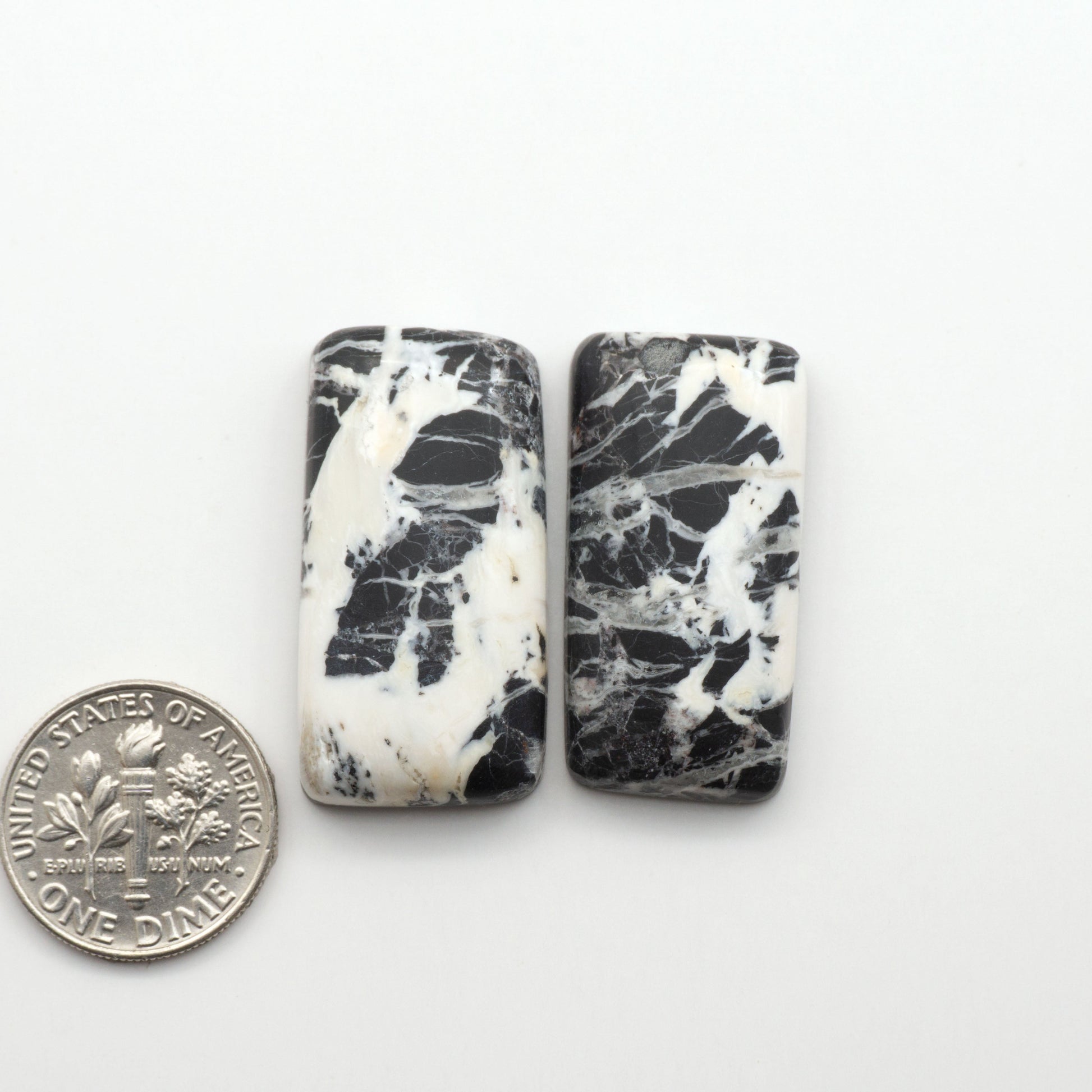 Natural White Buffalo Stone Cabochons are semi-precious gemstones cut into shapes ideal for jewelry-making, making them an excellent choice for artisans.