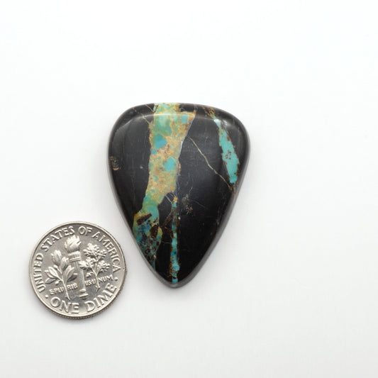 Black Jack Turquoise features a bold black color with striking veins of turquoise, making it a truly one-of-a-kind addition to your jewelry collection. 