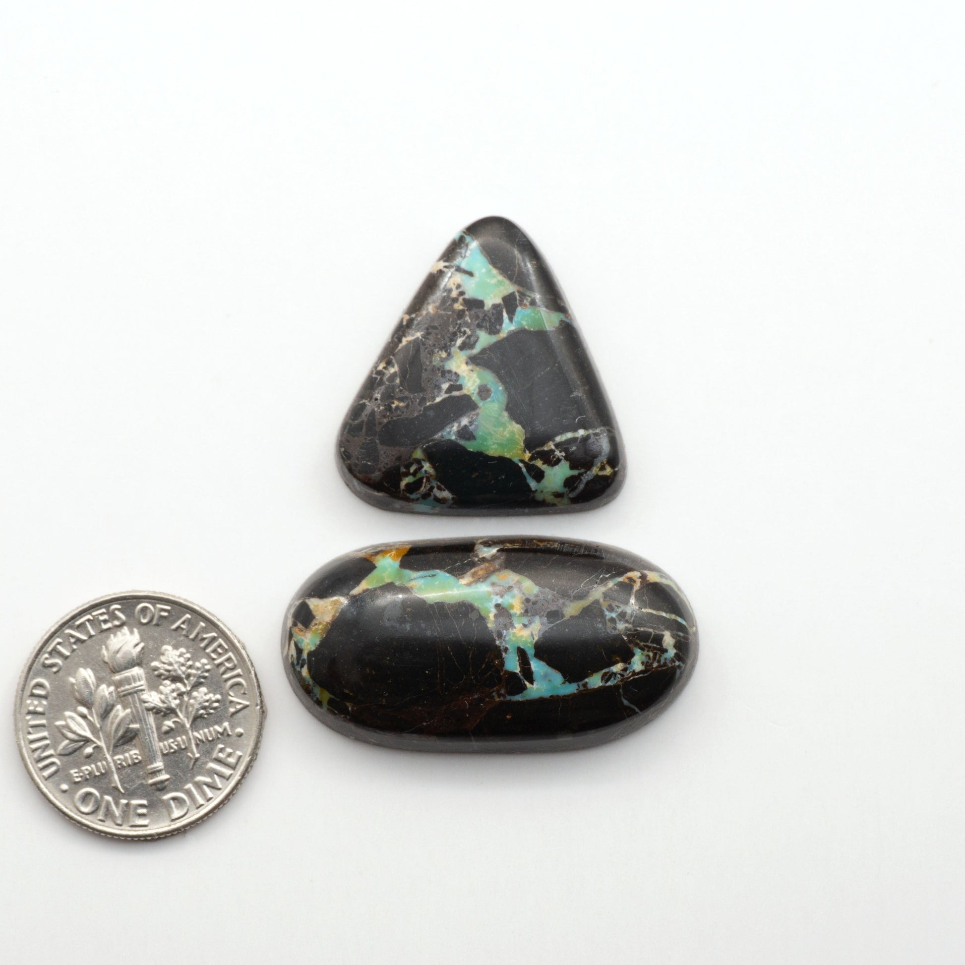 Black Jack Turquoise features a bold black color with striking veins of turquoise, making it a truly one-of-a-kind addition to your jewelry collection. 