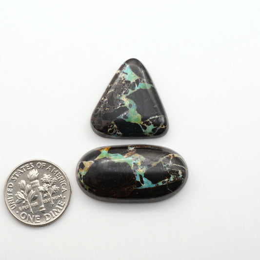 Black Jack Turquoise features a bold black color with striking veins of turquoise, making it a truly one-of-a-kind addition to your jewelry collection. 