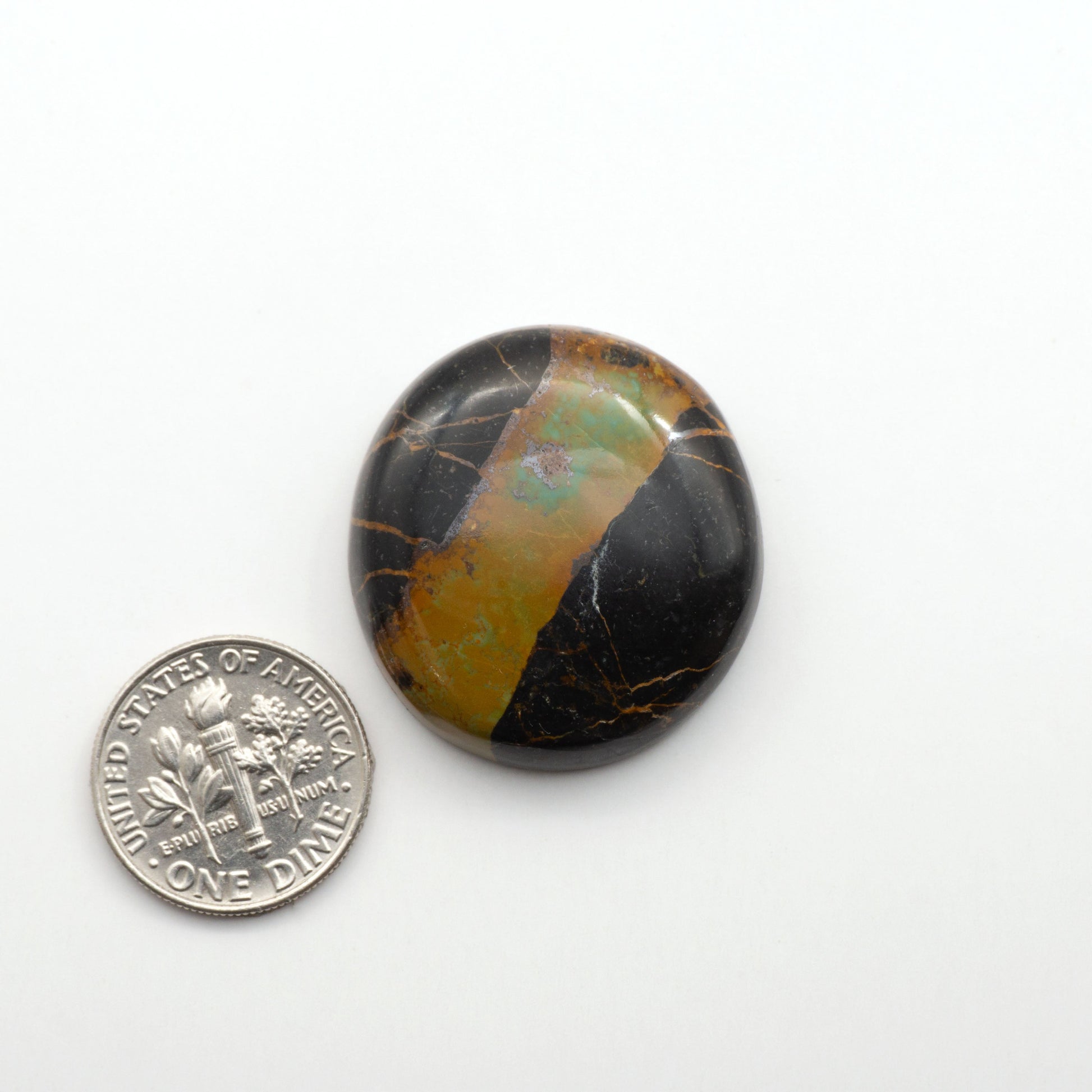 Black Jack Turquoise features a bold black color with striking veins of turquoise, making it a truly one-of-a-kind addition to your jewelry collection. 