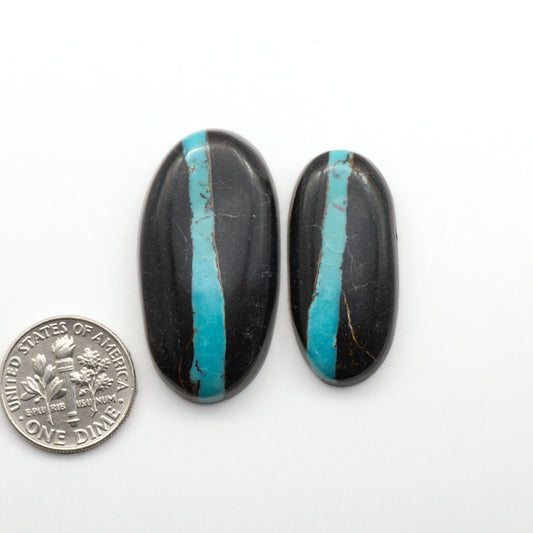Black Jack Turquoise features a bold black color with striking veins of turquoise, making it a truly one-of-a-kind addition to your jewelry collection. 