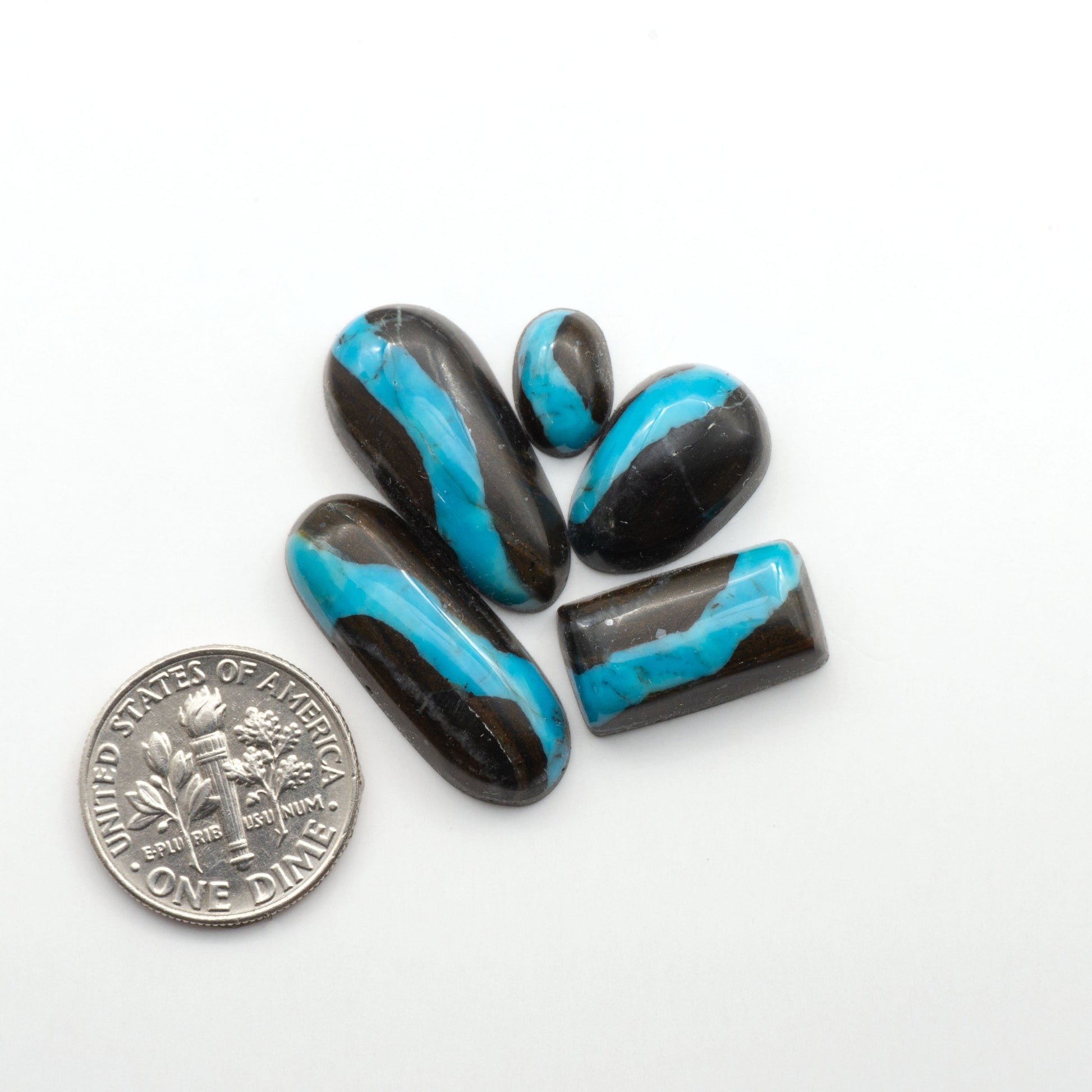 Black Jack Turquoise features a bold black color with striking veins of turquoise, making it a truly one-of-a-kind addition to your jewelry collection. 