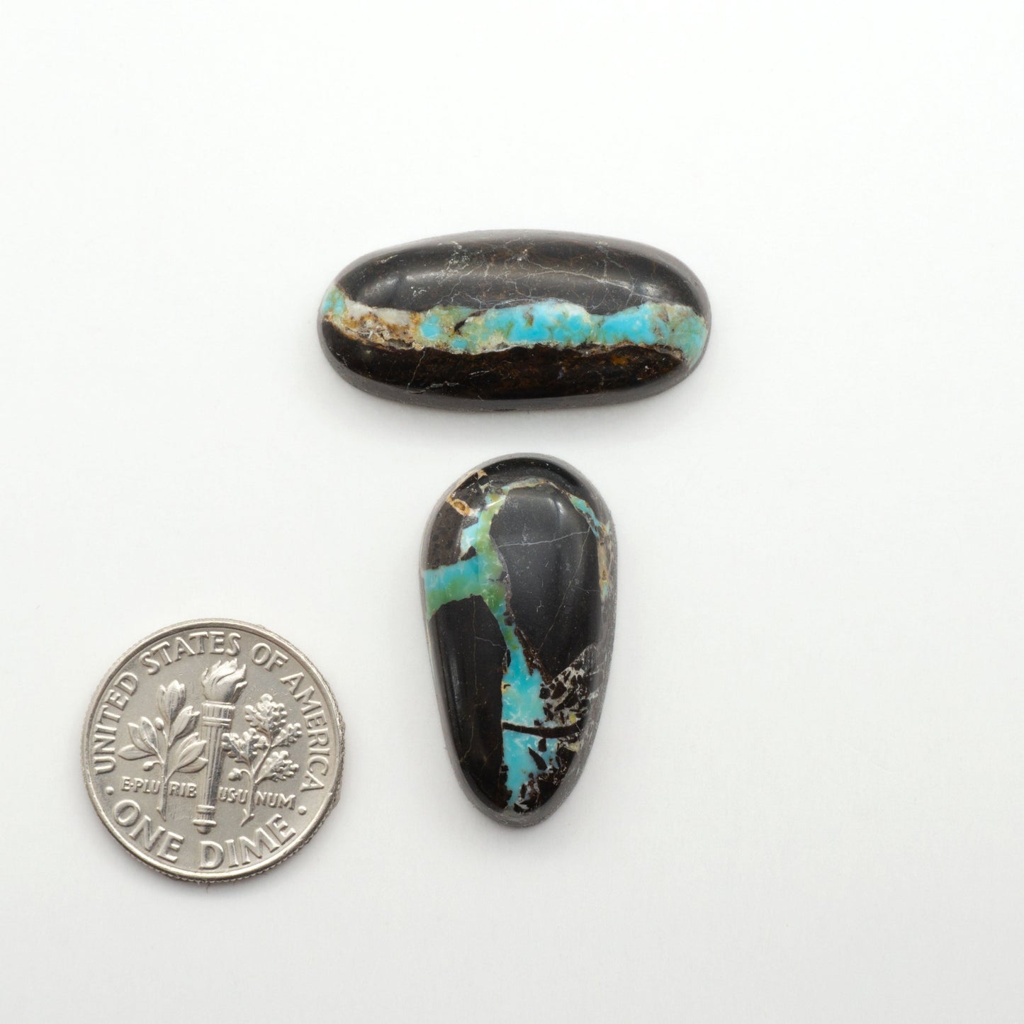 Black Jack Turquoise features a bold black color with striking veins of turquoise, making it a truly one-of-a-kind addition to your jewelry collection.

