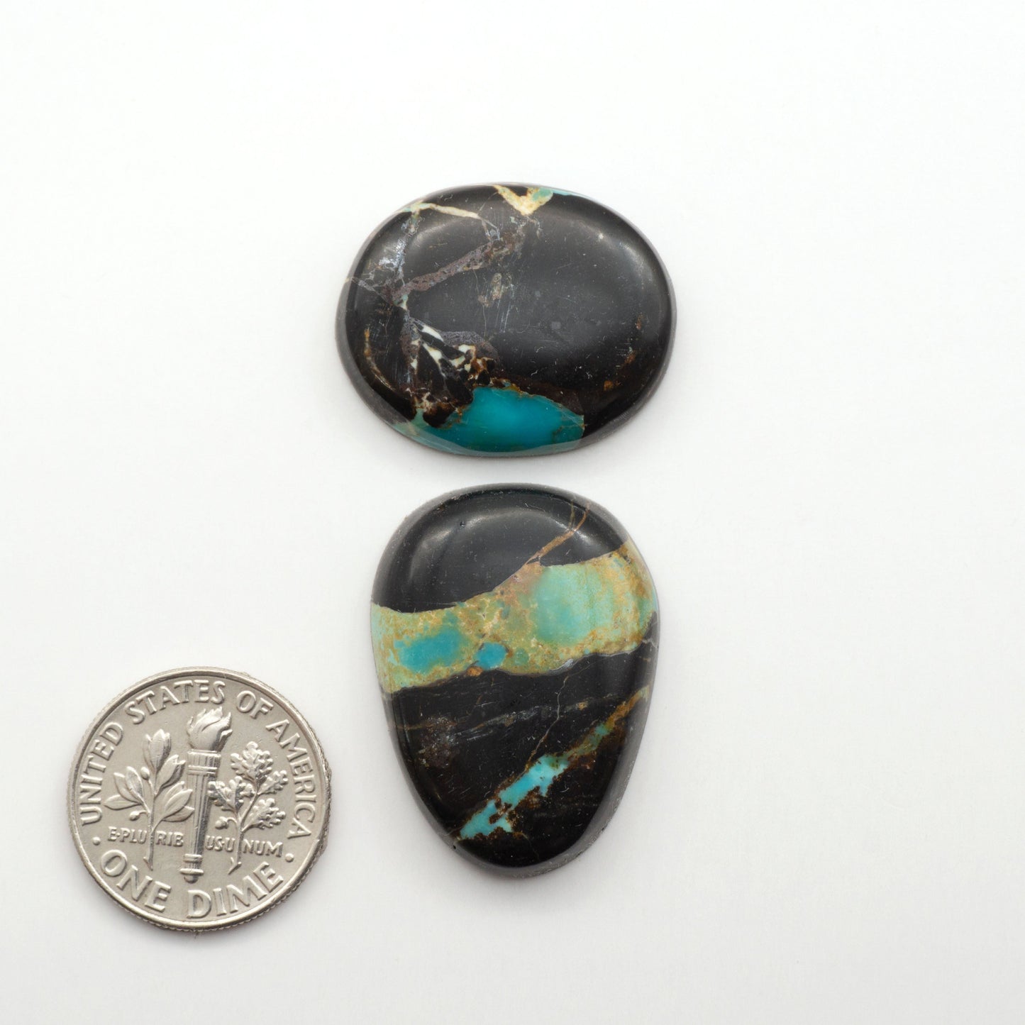 Black Jack Turquoise features a bold black color with striking veins of turquoise, making it a truly one-of-a-kind addition to your jewelry collection.

