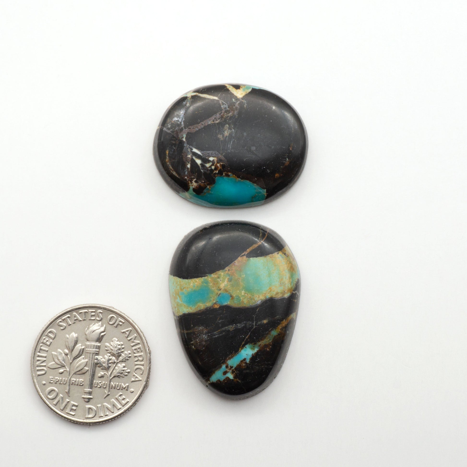 Black Jack Turquoise features a bold black color with striking veins of turquoise, making it a truly one-of-a-kind addition to your jewelry collection.

