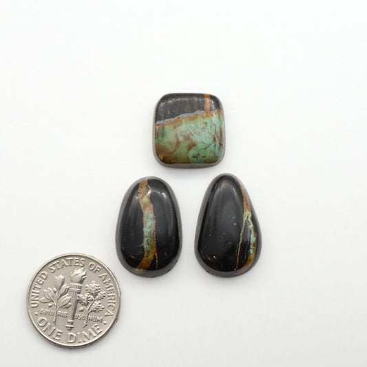 Black Jack Turquoise features a bold black color with striking veins of turquoise, making it a truly one-of-a-kind addition to your jewelry collection.


