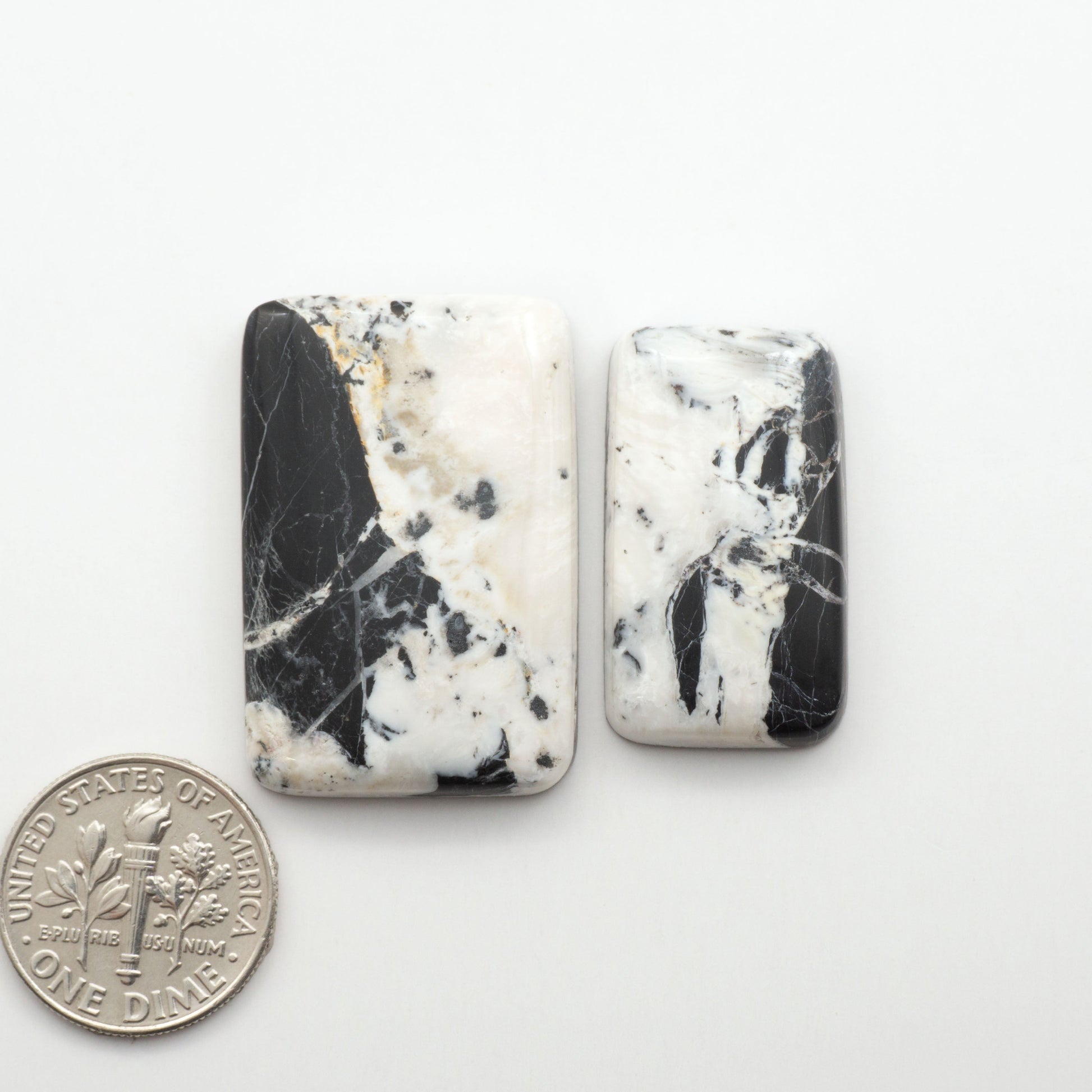 Natural White Buffalo Stone Cabochons are semi-precious gemstones cut into shapes ideal for jewelry-making, making them an excellent choice for artisans.