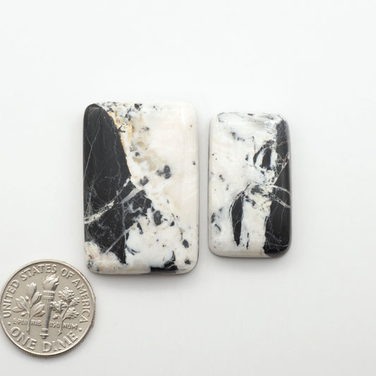 Natural White Buffalo Stone Cabochons are semi-precious gemstones cut into shapes ideal for jewelry-making, making them an excellent choice for artisans.