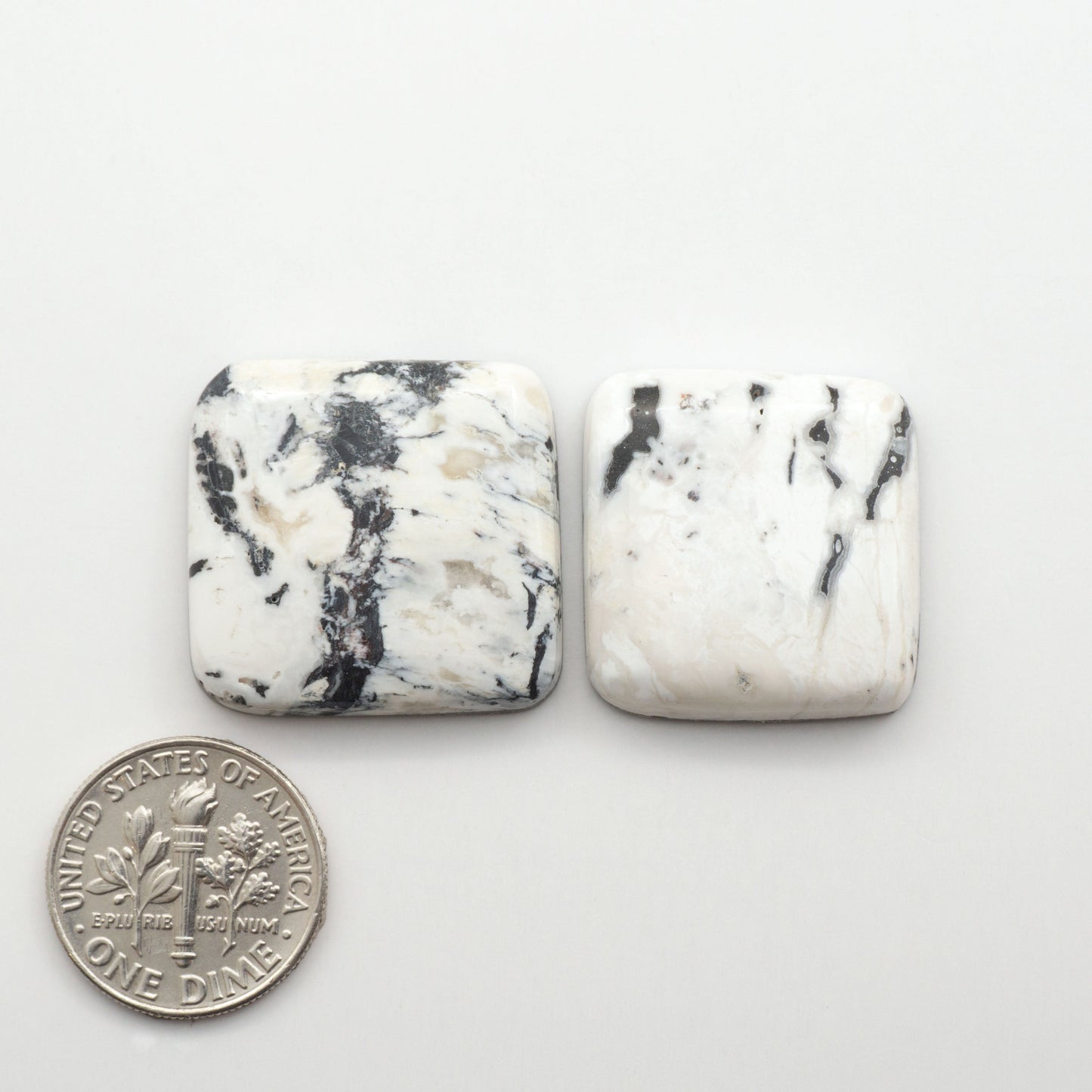 Natural White Buffalo Stone Cabochons are semi-precious gemstones cut into shapes ideal for jewelry-making, making them an excellent choice for artisans.
