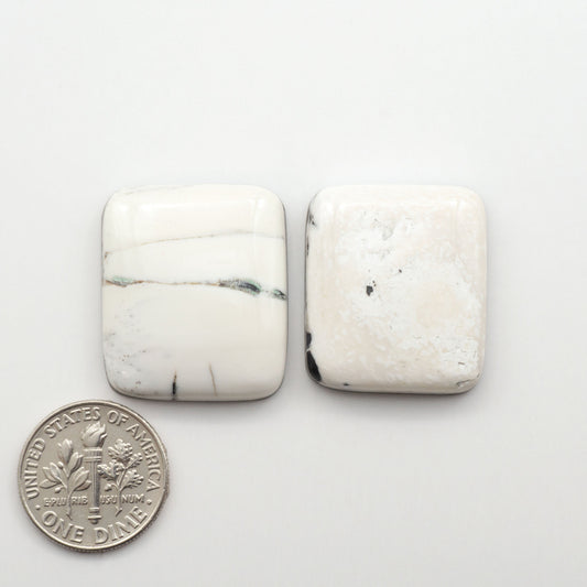 Natural White Buffalo Stone Cabochons are semi-precious gemstones cut into shapes ideal for jewelry-making, making them an excellent choice for artisans.