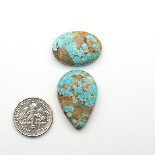 Kingman Turquoise Cabochons are a staple in the jewelry industry, known for their stunning blue-green color. Perfect for necklaces, earrings, and more!