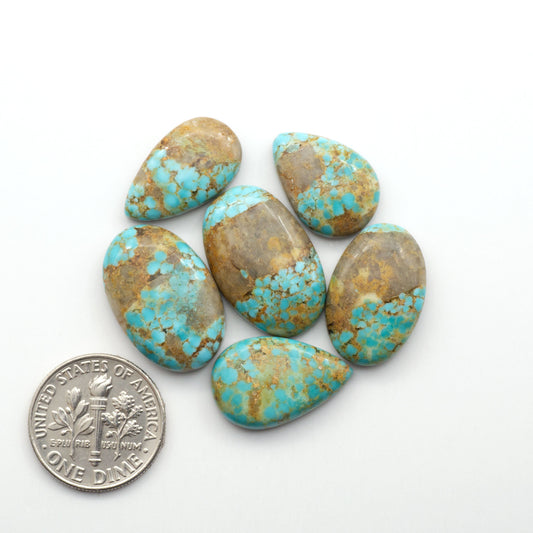 Kingman Turquoise Cabochons are a staple in the jewelry industry, known for their stunning blue-green color. Perfect for necklaces, earrings, and more!