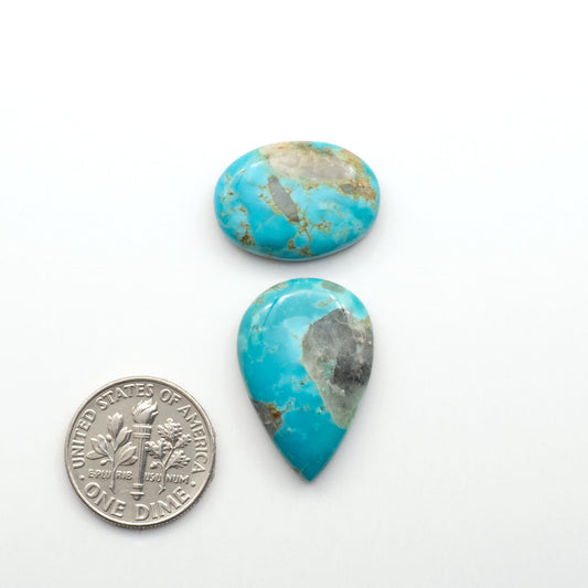 Kingman Turquoise Cabochons are a staple in the jewelry industry, known for their stunning blue-green color. Perfect for necklaces, earrings, and more!