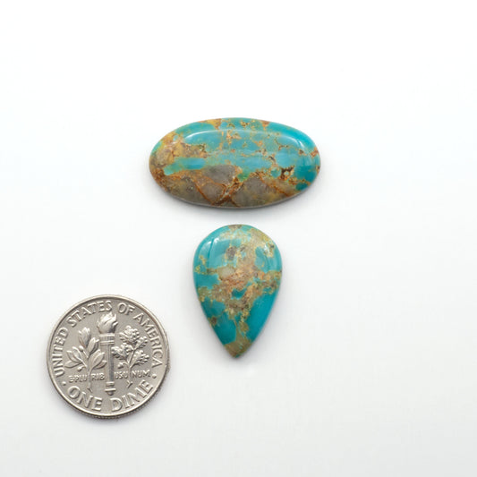 Kingman Turquoise Cabochons are a staple in the jewelry industry, known for their stunning blue-green color. Perfect for necklaces, earrings, and more!