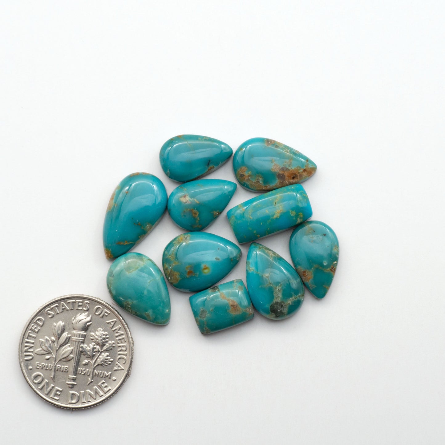 Kingman Turquoise Cabochons are a staple in the jewelry industry, known for their stunning blue-green color. Perfect for necklaces, earrings, and more!