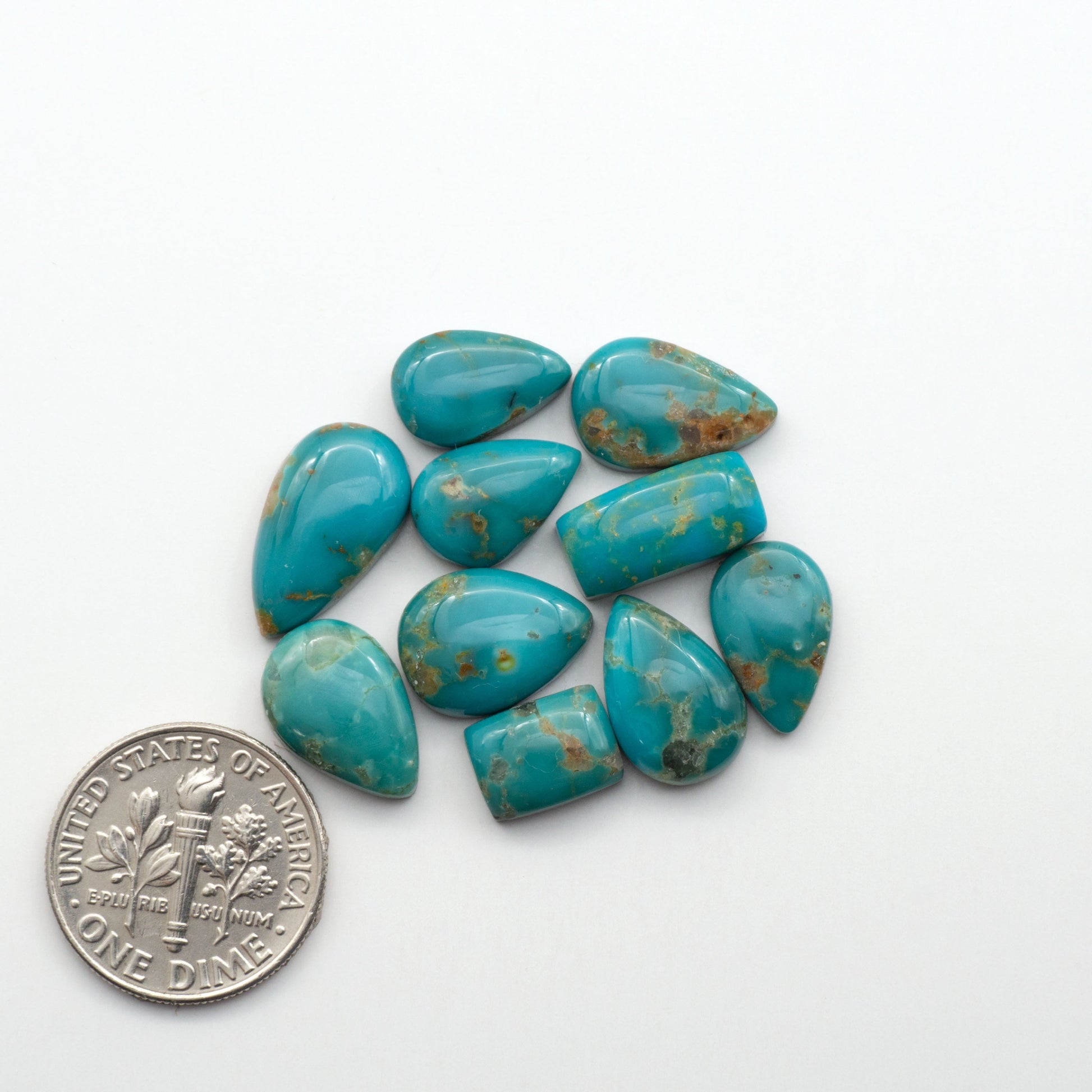 Kingman Turquoise Cabochons are a staple in the jewelry industry, known for their stunning blue-green color. Perfect for necklaces, earrings, and more!