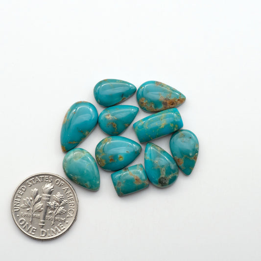 Kingman Turquoise Cabochons are a staple in the jewelry industry, known for their stunning blue-green color. Perfect for necklaces, earrings, and more!