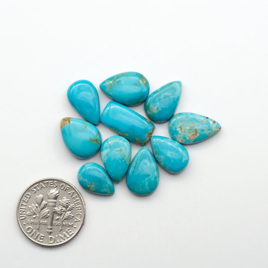 Kingman Turquoise Cabochons are a staple in the jewelry industry, known for their stunning blue-green color. Perfect for necklaces, earrings, and more!