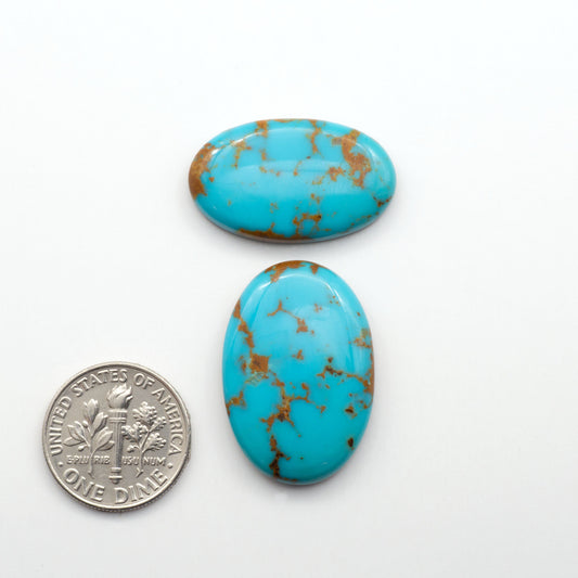Kingman Turquoise Cabochons are a staple in the jewelry industry, known for their stunning blue-green color. Perfect for necklaces, earrings, and more!