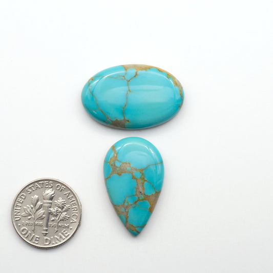 Kingman Turquoise Cabochons are a staple in the jewelry industry, known for their stunning blue-green color. Perfect for necklaces, earrings, and more!