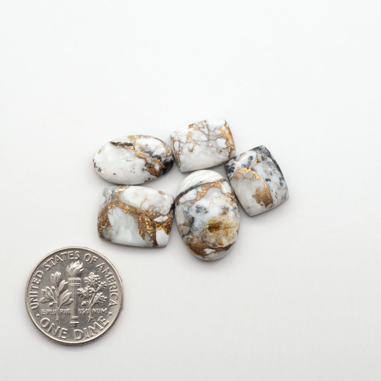 Elevate your jewelry pieces with these stunning White Buffalo Cabochons. With their unique and intricate patterns, they add a touch of elegance to any design.