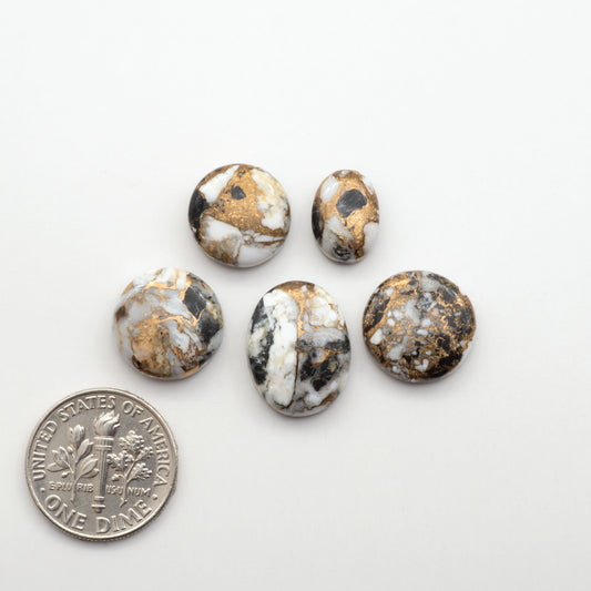 Elevate your jewelry pieces with these stunning White Buffalo Cabochons. With their unique and intricate patterns, they add a touch of elegance to any design.