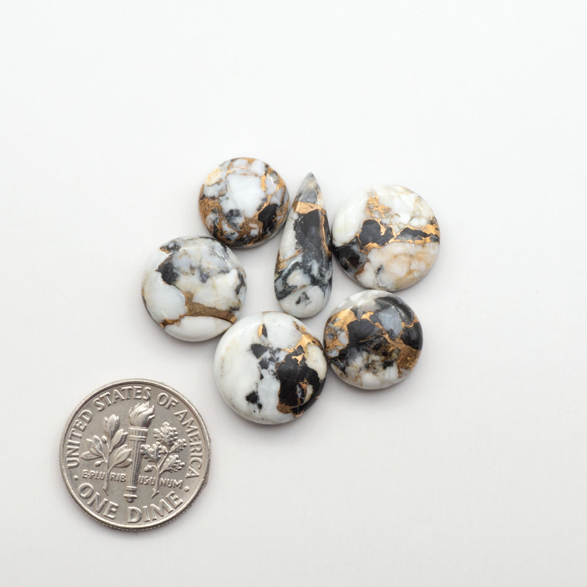 Elevate your jewelry pieces with these stunning White Buffalo Cabochons. With their unique and intricate patterns, they add a touch of elegance to any design.