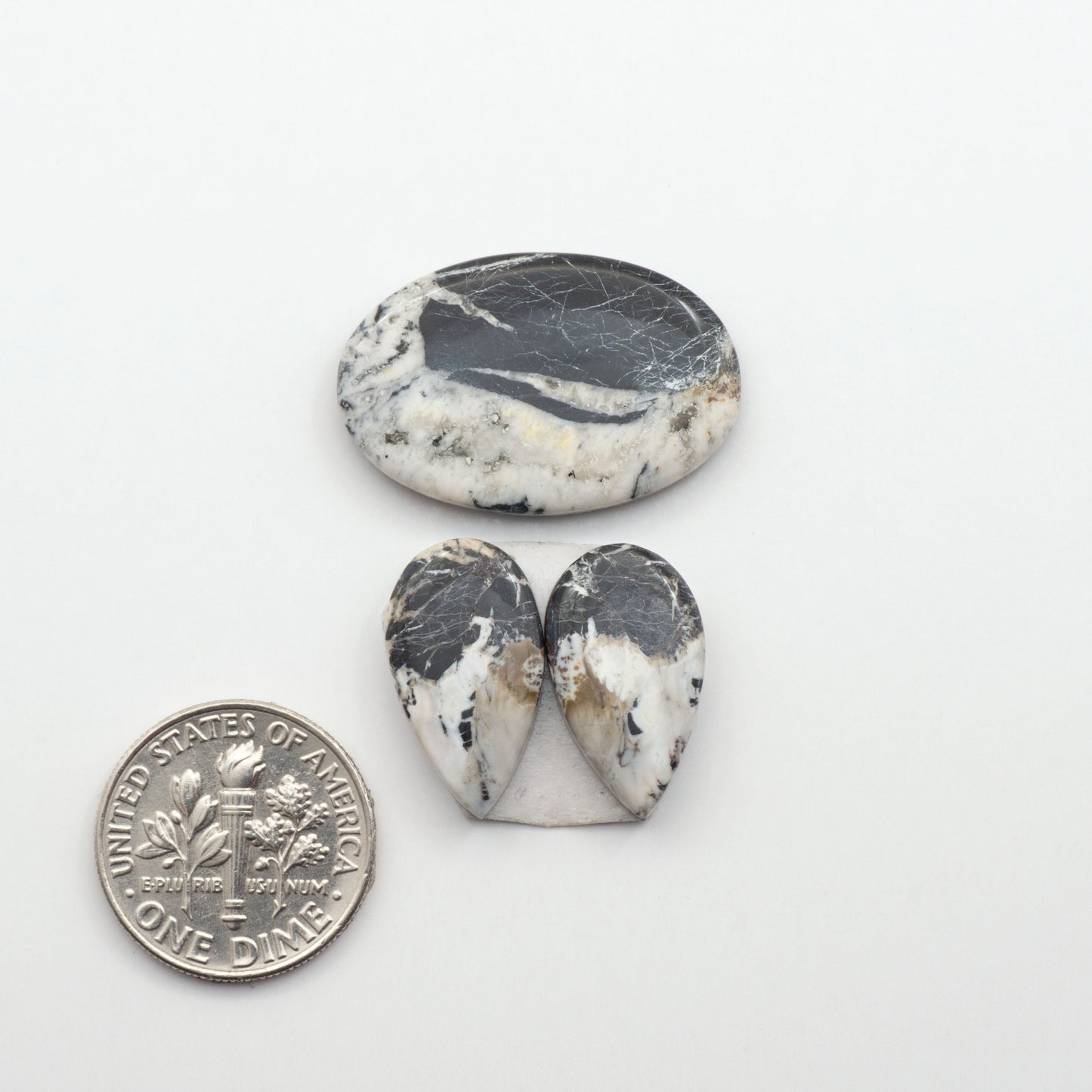 Natural White Buffalo Stone Cabochons are semi-precious gemstones cut into shapes ideal for jewelry-making, making them an excellent choice for artisans.