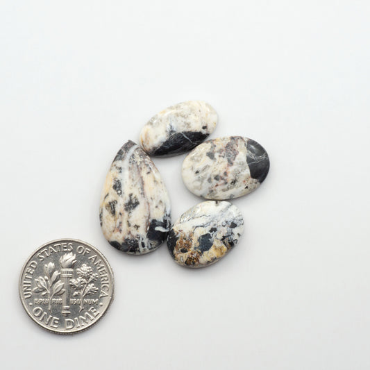 Natural White Buffalo Stone Cabochons are semi-precious gemstones cut into shapes ideal for jewelry-making, making them an excellent choice for artisans.