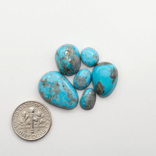 Nacozari turquoise cabochons are striking gemstones known for their vibrant blue to greenish-blue colors and pyrite, these stones are prized in jewelry making.