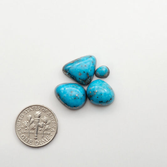 Nacozari turquoise cabochons are striking gemstones known for their vibrant blue to greenish-blue colors and pyrite, these stones are prized in jewelry making.
