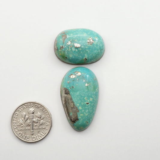 Nacozari turquoise cabochons are striking gemstones known for their vibrant blue to greenish-blue colors and pyrite, these stones are prized in jewelry making.