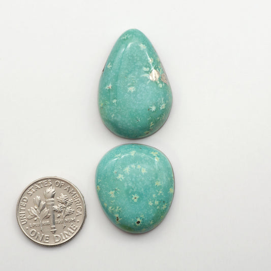 Nacozari turquoise cabochons are striking gemstones known for their vibrant blue to greenish-blue colors and pyrite, these stones are prized in jewelry making.