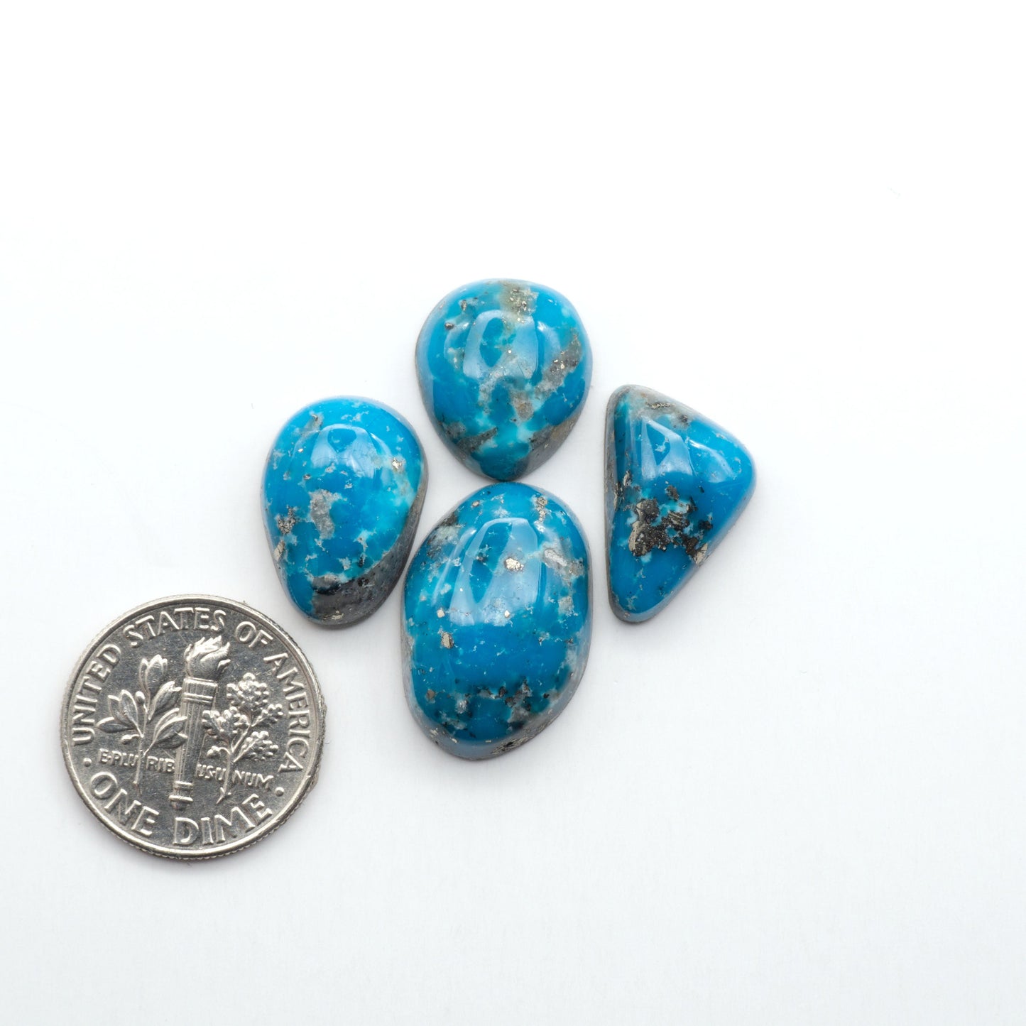 Nacozari turquoise cabochons are striking gemstones known for their vibrant blue to greenish-blue colors and pyrite, these stones are prized in jewelry making.