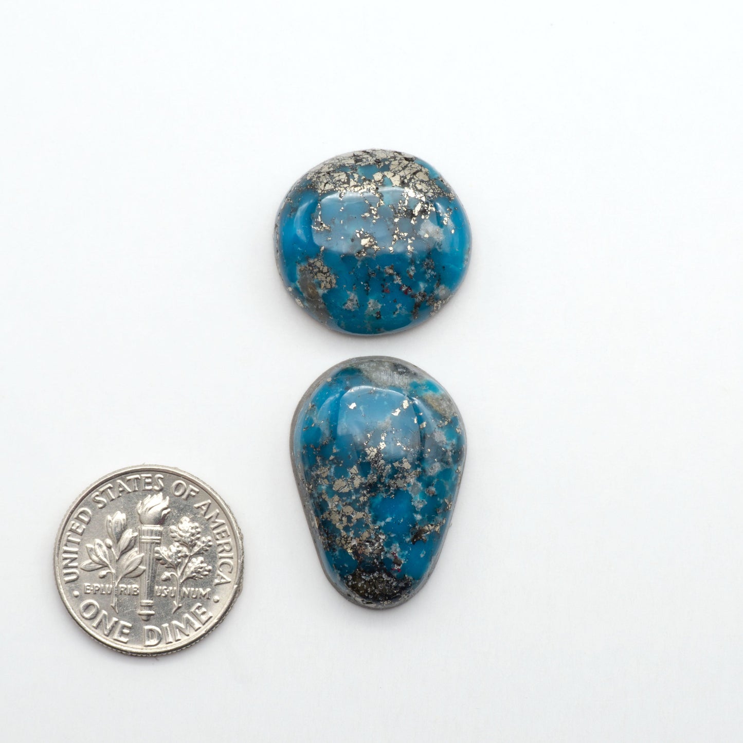 Nacozari turquoise cabochons are striking gemstones known for their vibrant blue to greenish-blue colors and pyrite, these stones are prized in jewelry making.