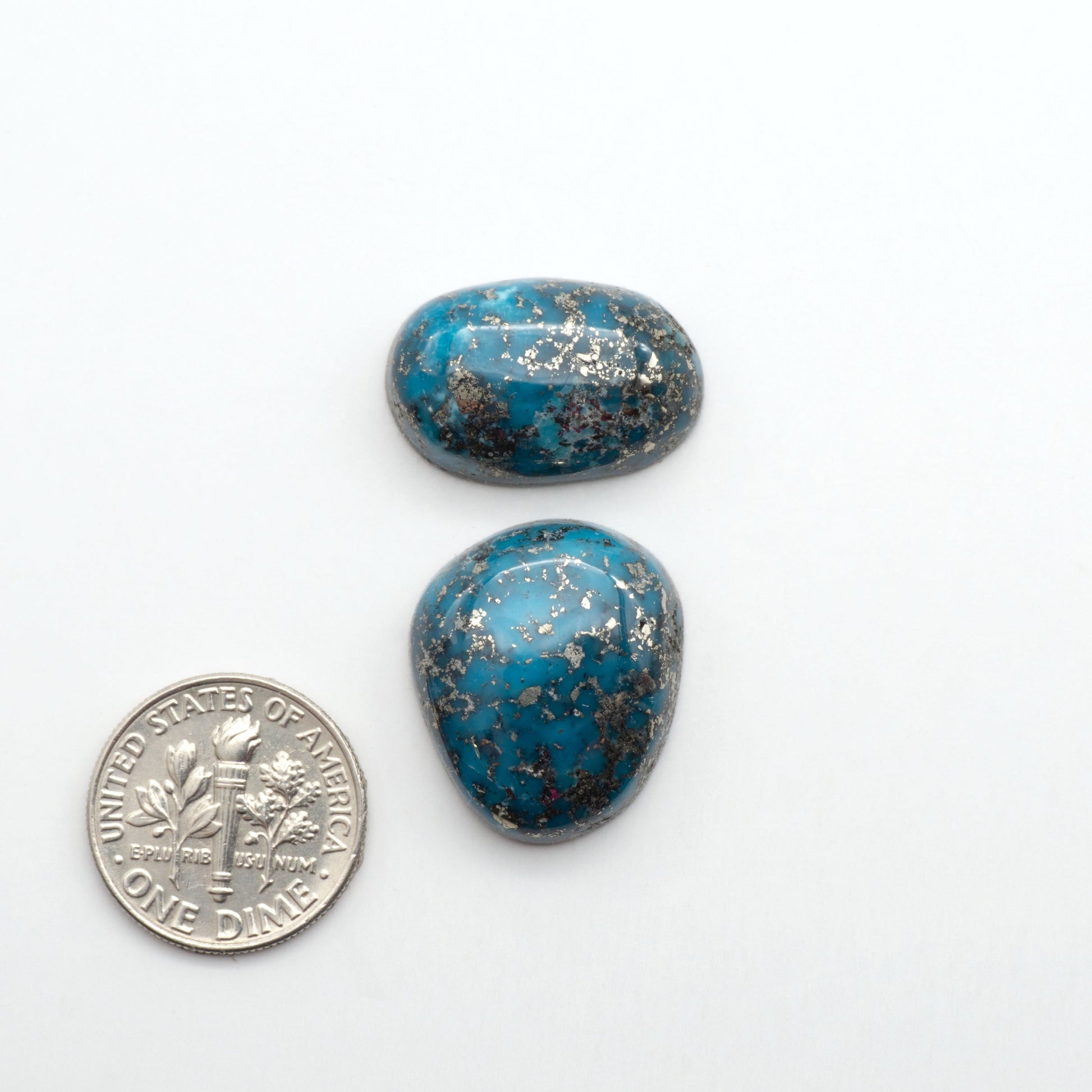 Nacozari turquoise cabochons are striking gemstones known for their vibrant blue to greenish-blue colors and pyrite, these stones are prized in jewelry making.