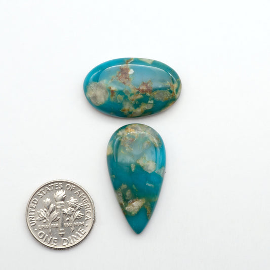 Kingman Turquoise Cabochons are a staple in the jewelry industry, known for their stunning blue-green color. Perfect for necklaces, earrings, and more!