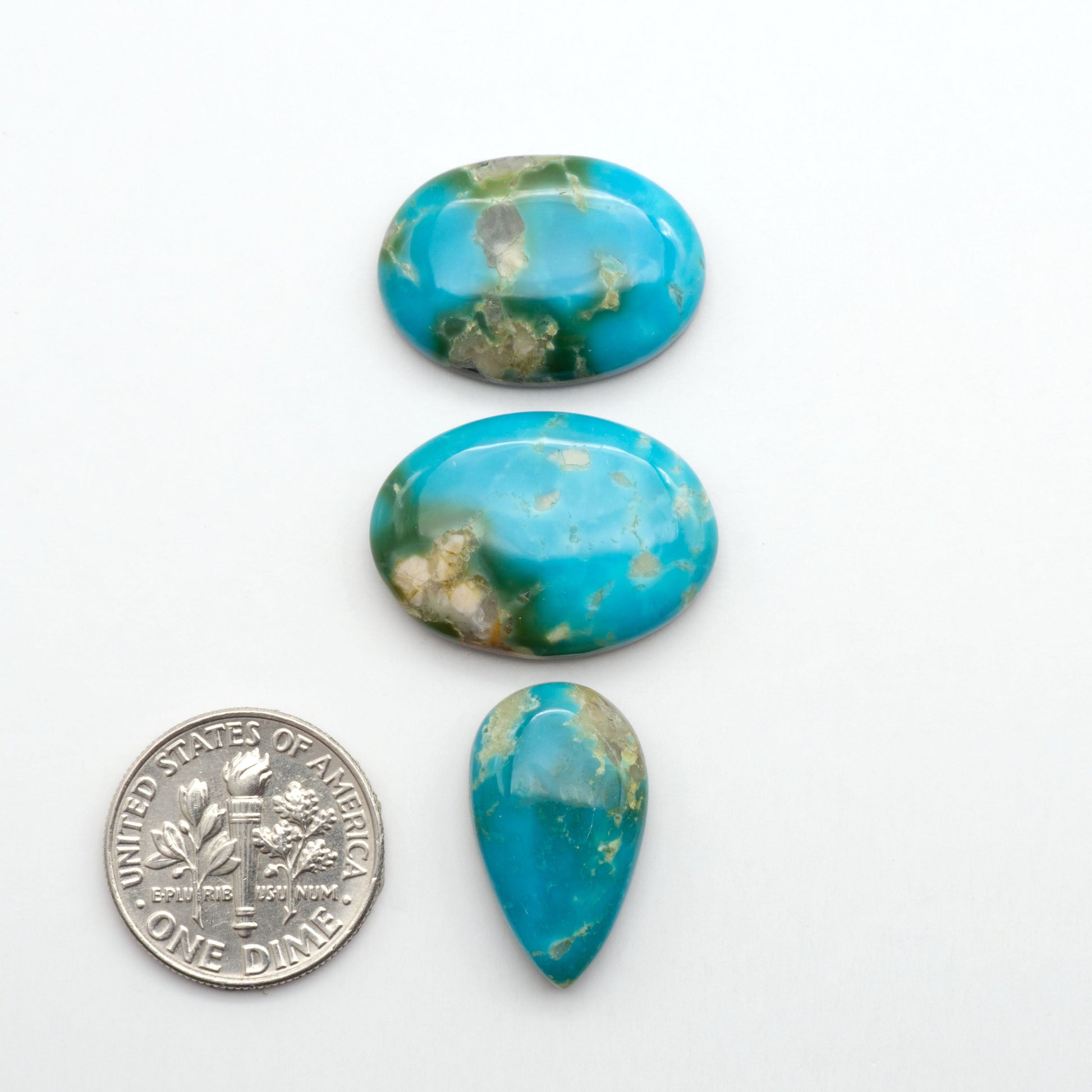 Kingman Turquoise Cabochons are a staple in the jewelry industry, known for their stunning blue-green color. Perfect for necklaces, earrings, and more!