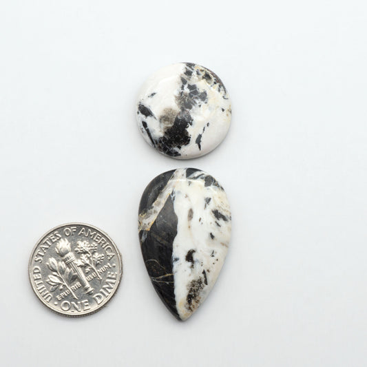 Natural White Buffalo Stone Cabochons are semi-precious gemstones cut into shapes ideal for jewelry-making, making them an excellent choice for artisans.