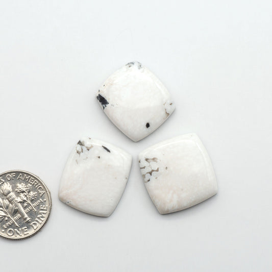 Natural White Buffalo Stone Cabochons are semi-precious gemstones cut into shapes ideal for jewelry-making, making them an excellent choice for artisans.