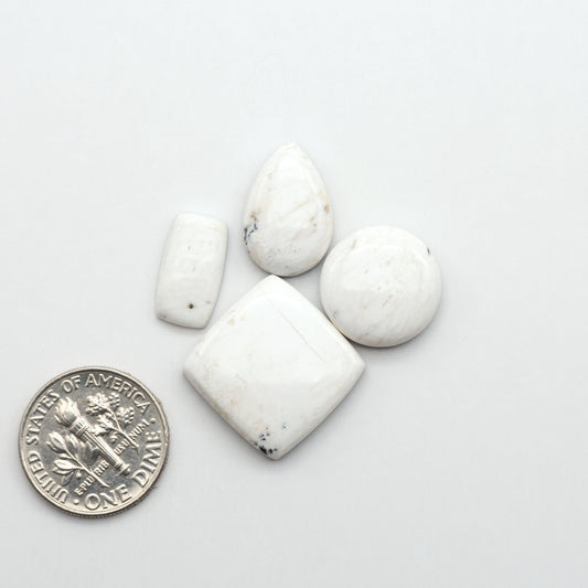 Natural White Buffalo Stone Cabochons are semi-precious gemstones cut into shapes ideal for jewelry-making, making them an excellent choice for artisans.