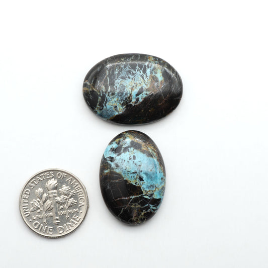 Black Jack Turquoise features a bold black color with striking veins of turquoise, making it a truly one-of-a-kind addition to your jewelry collection.