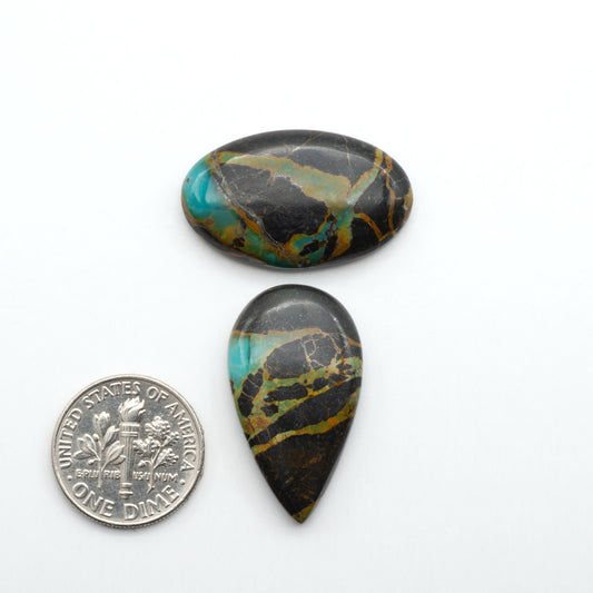 Black Jack Turquoise features a bold black color with striking veins of turquoise, making it a truly one-of-a-kind addition to your jewelry collection.