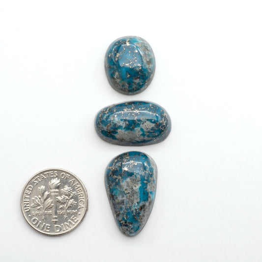Nacozari turquoise cabochons are striking gemstones known for their vibrant blue to greenish-blue colors and pyrite, these stones are prized in jewelry making.