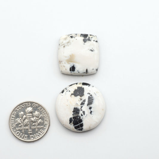 Natural White Buffalo Stone Cabochons are semi-precious gemstones cut into shapes ideal for jewelry-making, making them an excellent choice for artisans.