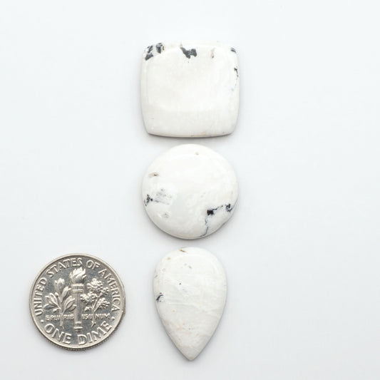 Natural White Buffalo Stone Cabochons are semi-precious gemstones cut into shapes ideal for jewelry-making, making them an excellent choice for artisans.
