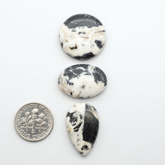 Natural White Buffalo Stone Cabochons are semi-precious gemstones cut into shapes ideal for jewelry-making, making them an excellent choice for artisans.