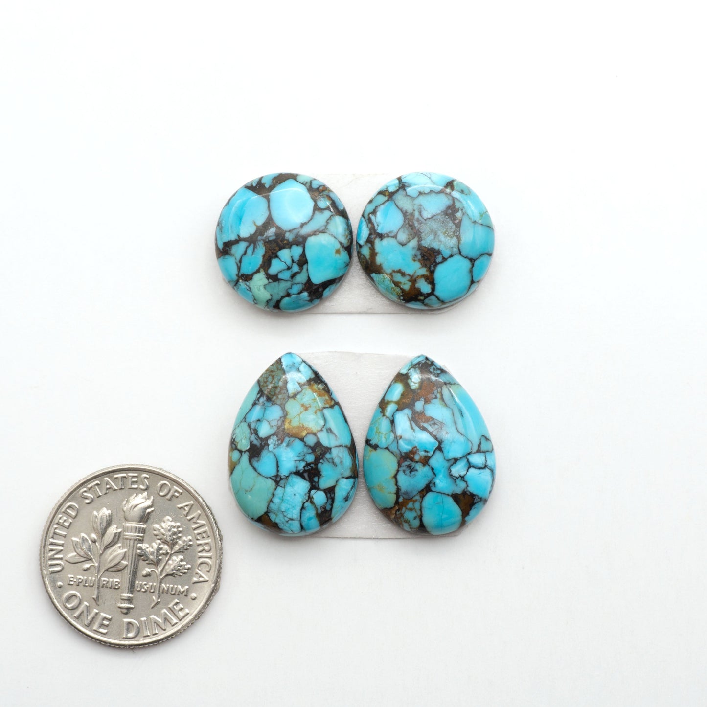Enhance your jewelry designs with Pressed Turquoise Nugget Cabochons. Crafted from composite materials they add a captivating touch to your creations.