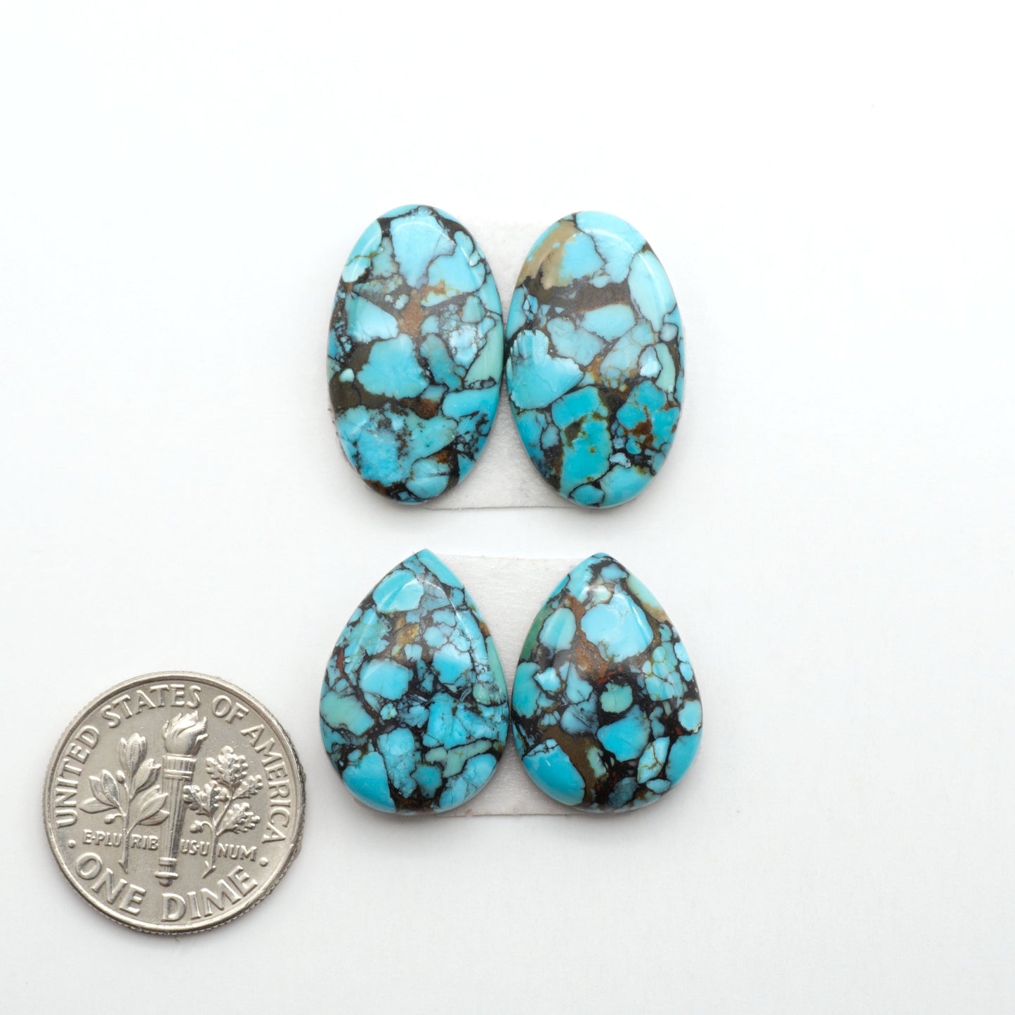 Enhance your jewelry designs with Pressed Turquoise Nugget Cabochons. Crafted from composite materials they add a captivating touch to your creations.